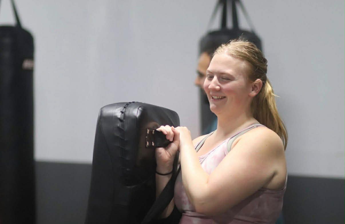 Holding the thai pads in Muay Thai class.